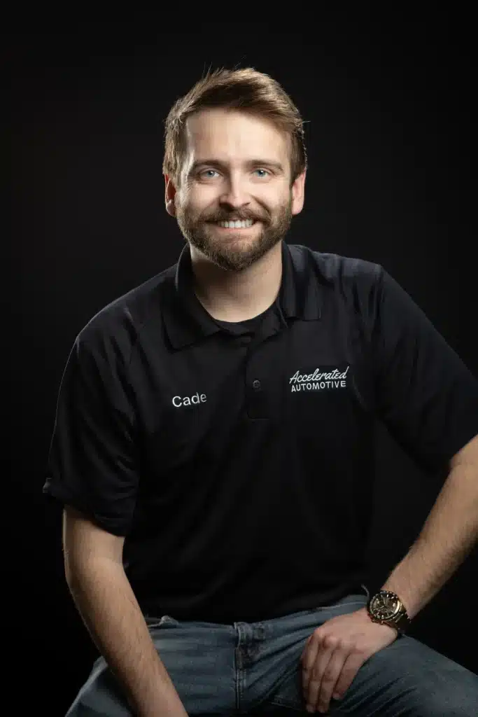 Cade Wingender, Client Advocate at Accelerated Automotive, studio portrait wearing company polo.