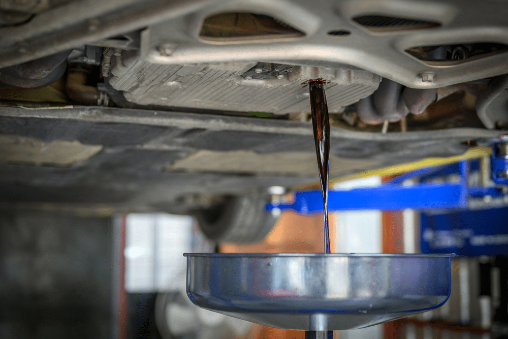 Transmission Flush vs. Drain and Fill, Transmission Service in Bennington, NE At Accelerated. Image of Transmission fluid draining into a collection pan